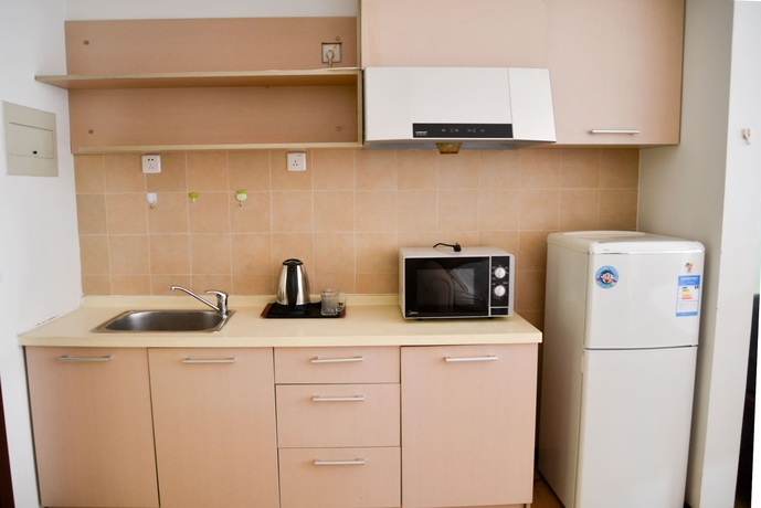 Imagen de la habitación del Hotel Tianjin Chaoju Apartment. Foto 16