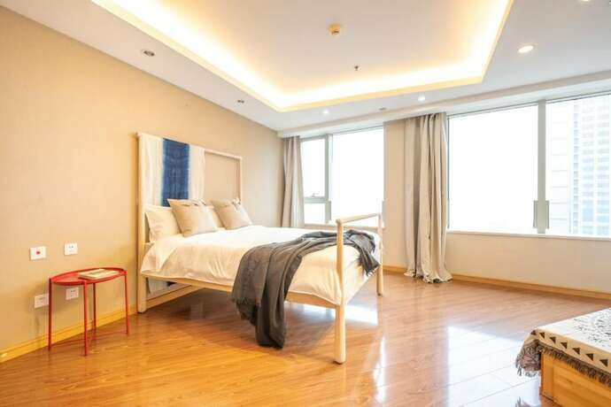 Imagen de la habitación del Hotel Tianjin G'apartment. Foto 15