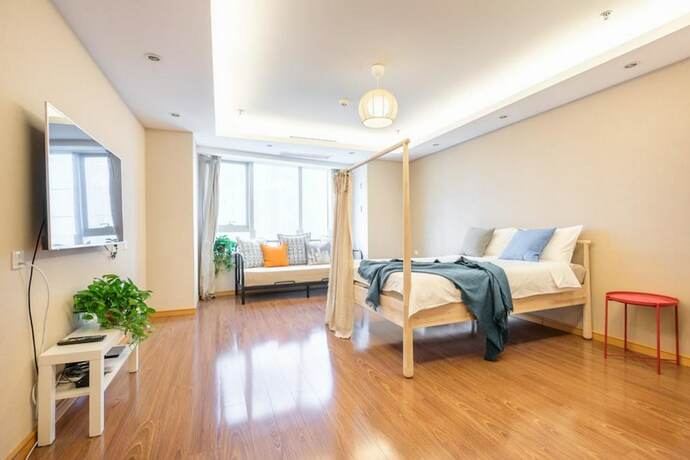 Imagen de la habitación del Hotel Tianjin G'apartment. Foto 22