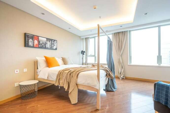 Imagen de la habitación del Hotel Tianjin G'apartment. Foto 24