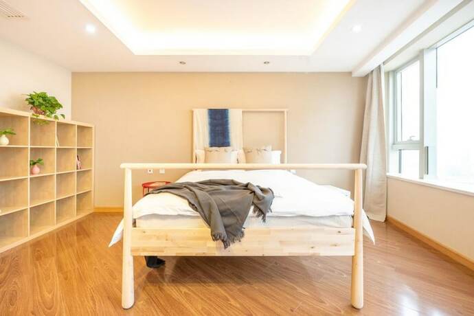 Imagen de la habitación del Hotel Tianjin G'apartment. Foto 25