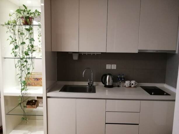 Imagen de la habitación del Hotel Tianjin G'apartment. Foto 26