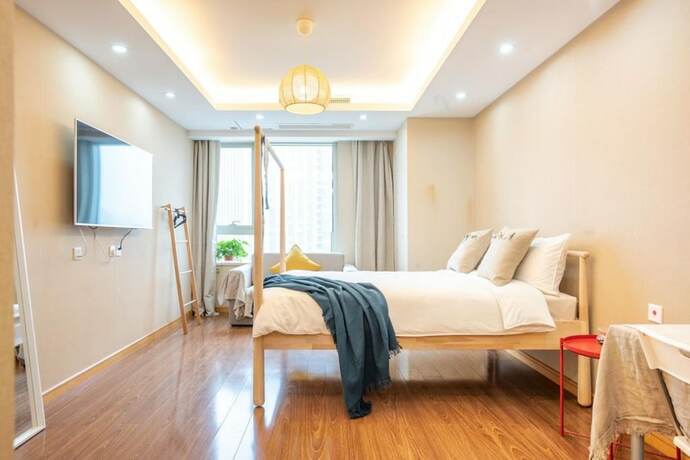 Imagen de la habitación del Hotel Tianjin G'apartment. Foto 31