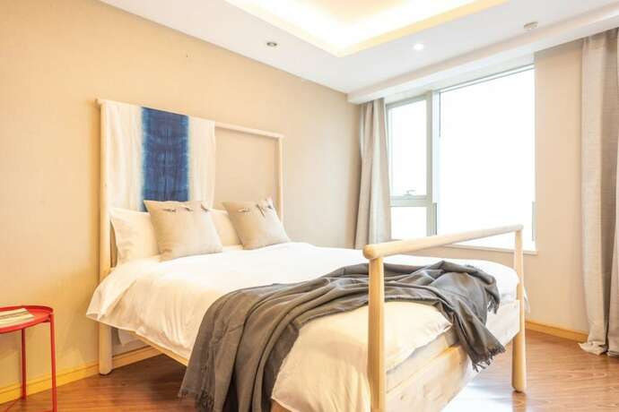 Imagen de la habitación del Hotel Tianjin G'apartment. Foto 34