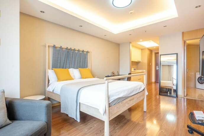 Imagen de la habitación del Hotel Tianjin G'apartment. Foto 37