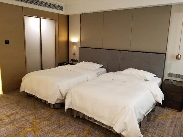 Imagen de la habitación del Hotel Tianjin Golden Crown. Foto 4