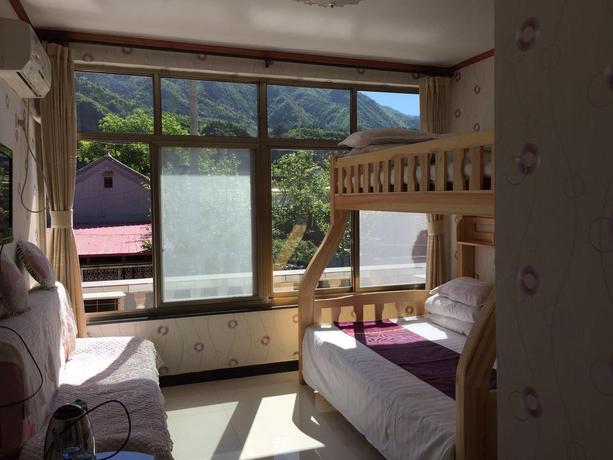 Imagen de la habitación del Hotel Tianjin Huangyaguan Great Wall Home. Foto 2