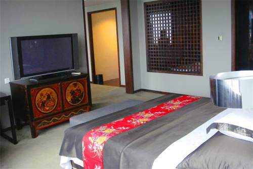 Imagen de la habitación del Hotel Tianjin In-zone. Foto 1