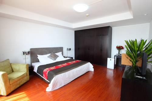 Imagen de la habitación del Hotel Tianjin In-zone. Foto 3