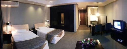 Imagen de la habitación del Hotel Tianjin In-zone. Foto 6