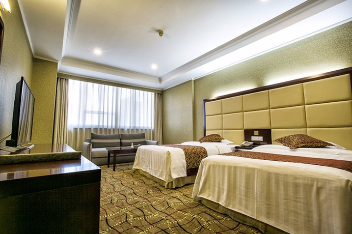 Imagen de la habitación del Hotel Tianjin Ocean. Foto 11
