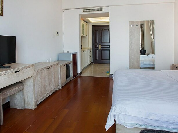 Imagen de la habitación del Hotel Tianjin Saina Mansion Service Apartment. Foto 12