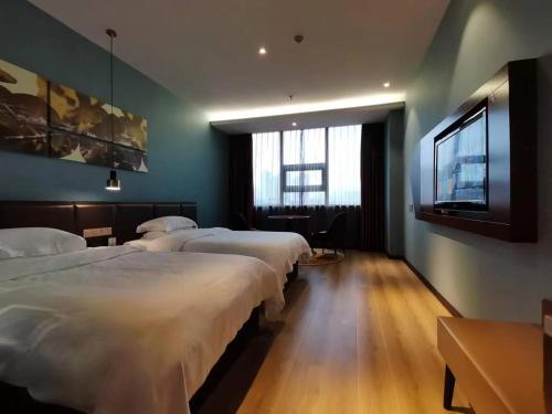 Imagen de la habitación del Hotel Tianjin Wuhe Business. Foto 20