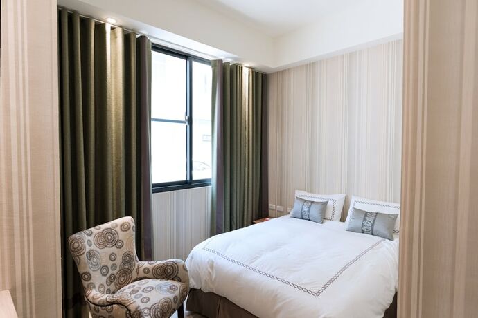 Imagen de la habitación del Hotel Tianli. Foto 15