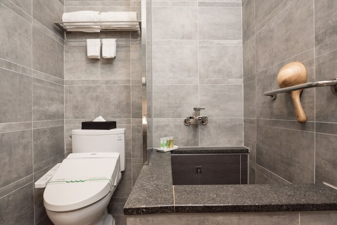 Imagen de la habitación del Hotel Tianli. Foto 18