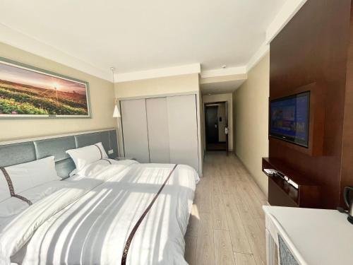 Imagen de la habitación del Hotel Tianshui Times Zhangjiagang. Foto 13
