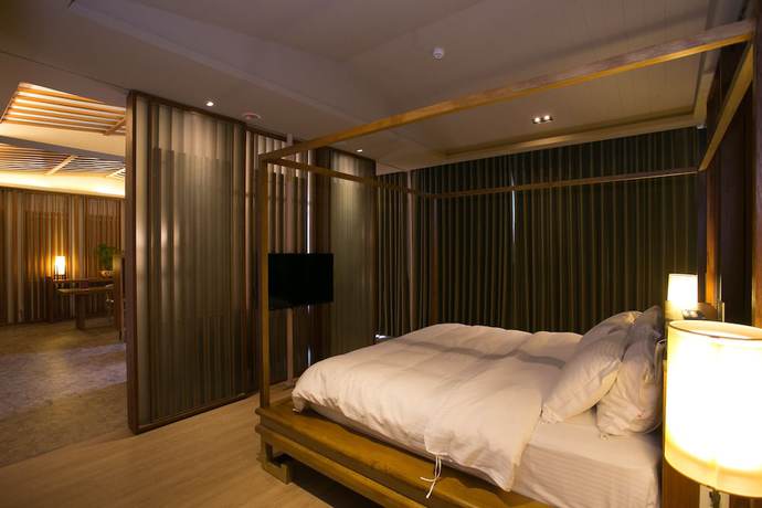 Imagen de la habitación del Hotel Tianxiaju Motel. Foto 13