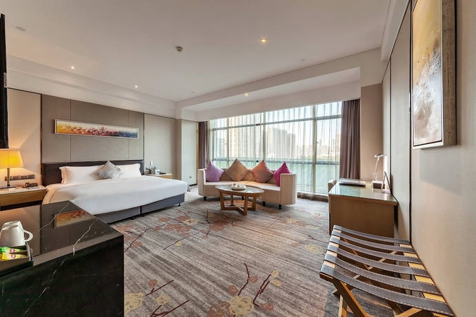 Imagen de la habitación del Hotel Tianyuan Junlong. Foto 2