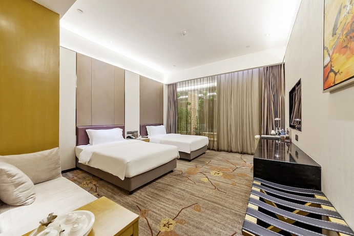 Imagen de la habitación del Hotel Tianyuan Junlong. Foto 4