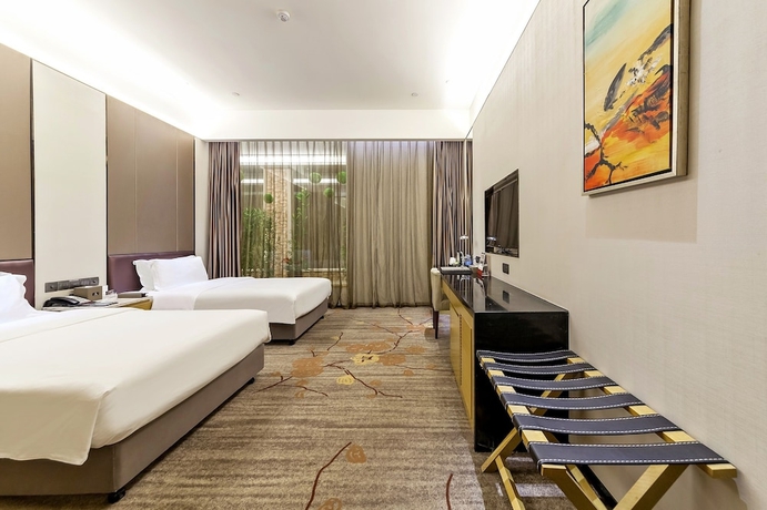 Imagen de la habitación del Hotel Tianyuan Junlong. Foto 5