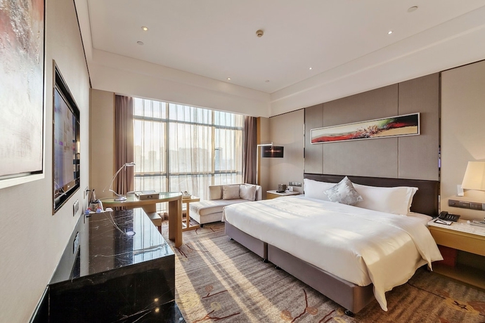 Imagen de la habitación del Hotel Tianyuan Junlong. Foto 6