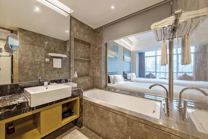 Imagen de la habitación del Hotel Tianyuan Junlong. Foto 7