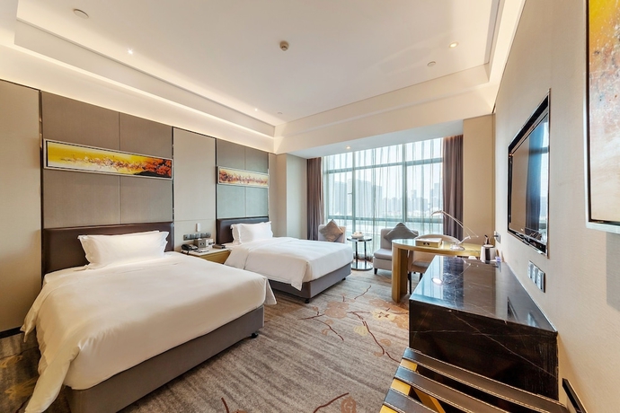 Imagen de la habitación del Hotel Tianyuan Junlong. Foto 10