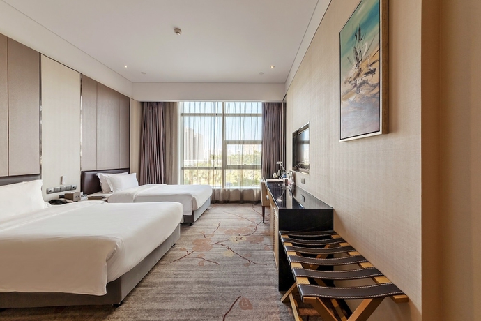 Imagen de la habitación del Hotel Tianyuan Junlong. Foto 11