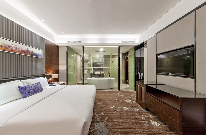 Imagen de la habitación del Hotel Tianyuan Junlong. Foto 12