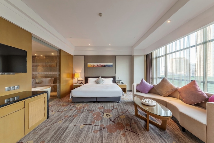 Imagen de la habitación del Hotel Tianyuan Junlong. Foto 13