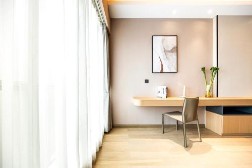 Imagen de la habitación del Hotel Tianyue S. Foto 17