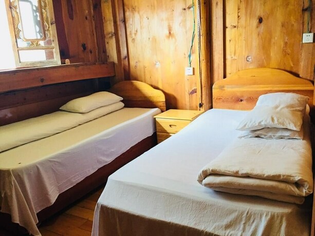 Imagen de la habitación del Hotel Tibet Guest House, Shangri-La. Foto 9