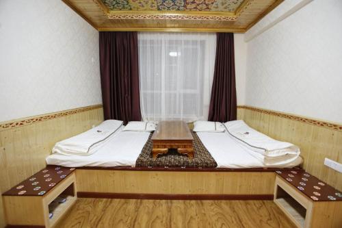 Imagen de la habitación del Hotel Tibetan Family. Foto 8