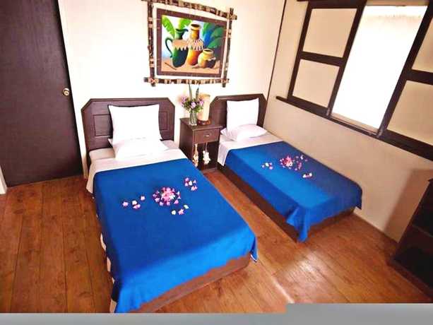 Imagen de la habitación del Hotel Ticao Island Resort. Foto 18