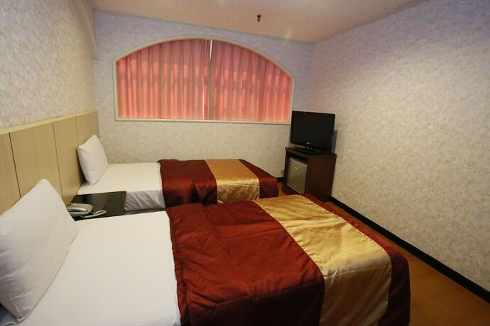 Imagen de la habitación del Hotel Tie Dao. Foto 23