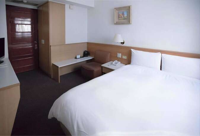 Imagen de la habitación del Hotel Tien Chin. Foto 2