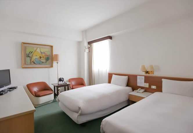Imagen de la habitación del Hotel Tien Chin. Foto 3