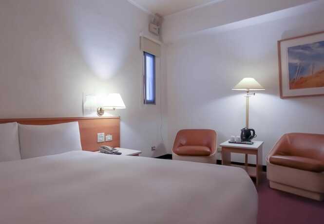 Imagen de la habitación del Hotel Tien Chin. Foto 7