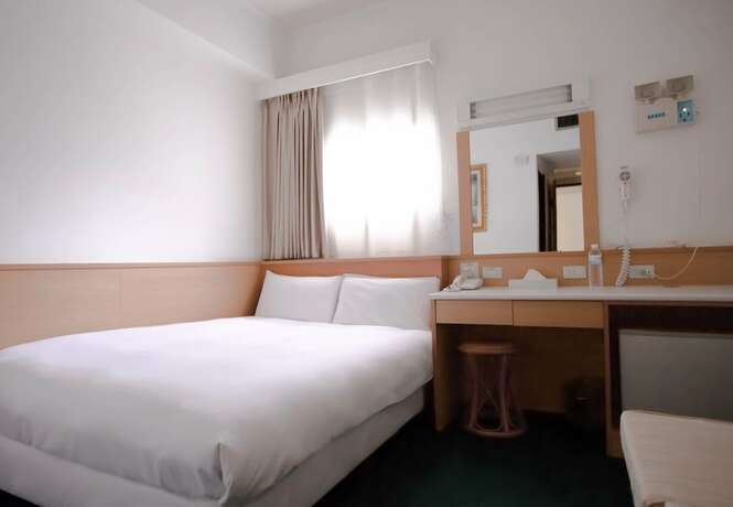Imagen de la habitación del Hotel Tien Chin. Foto 10