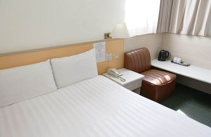 Imagen de la habitación del Hotel Tien Chin. Foto 11