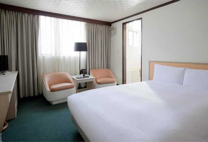 Imagen de la habitación del Hotel Tien Chin. Foto 12