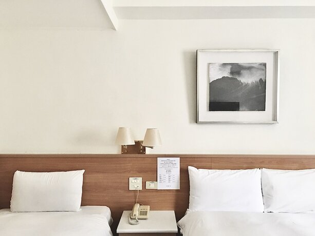 Imagen de la habitación del Hotel Tien Chin. Foto 14