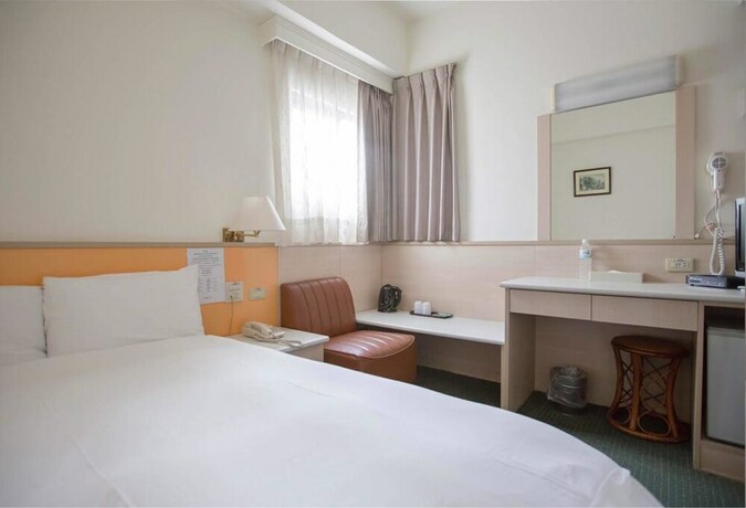 Imagen de la habitación del Hotel Tien Chin. Foto 17