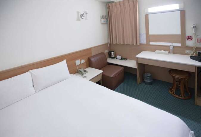 Imagen de la habitación del Hotel Tien Chin. Foto 18