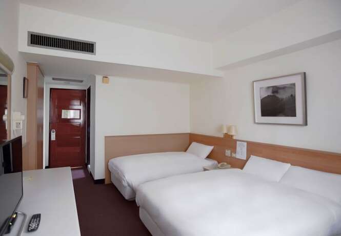 Imagen de la habitación del Hotel Tien Chin. Foto 19