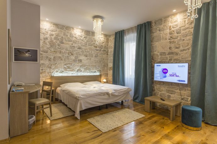 Imagen de la habitación del Hotel Tifani Luxury Rooms. Foto 3