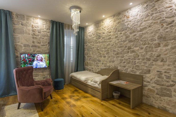 Imagen de la habitación del Hotel Tifani Luxury Rooms. Foto 13