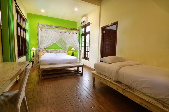 Imagen de la habitación del Hotel Tigalima Homestay. Foto 4