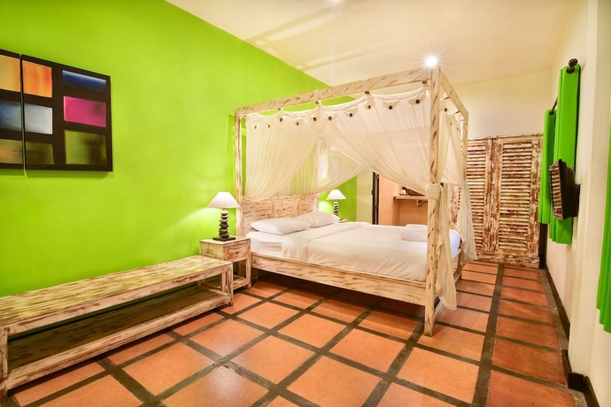 Imagen de la habitación del Hotel Tigalima Homestay. Foto 9