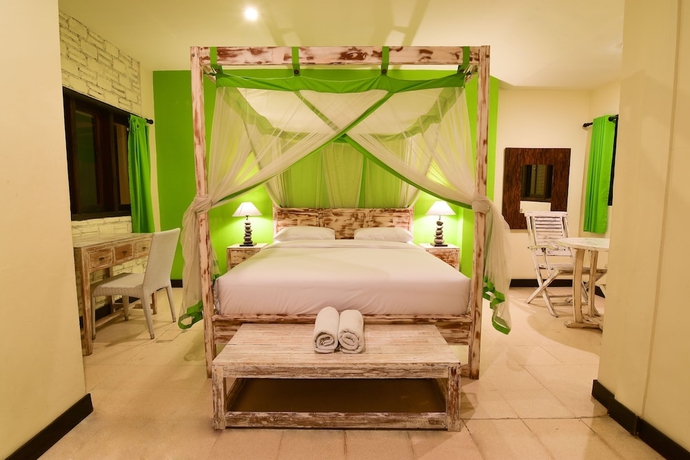Imagen de la habitación del Hotel Tigalima Homestay. Foto 10